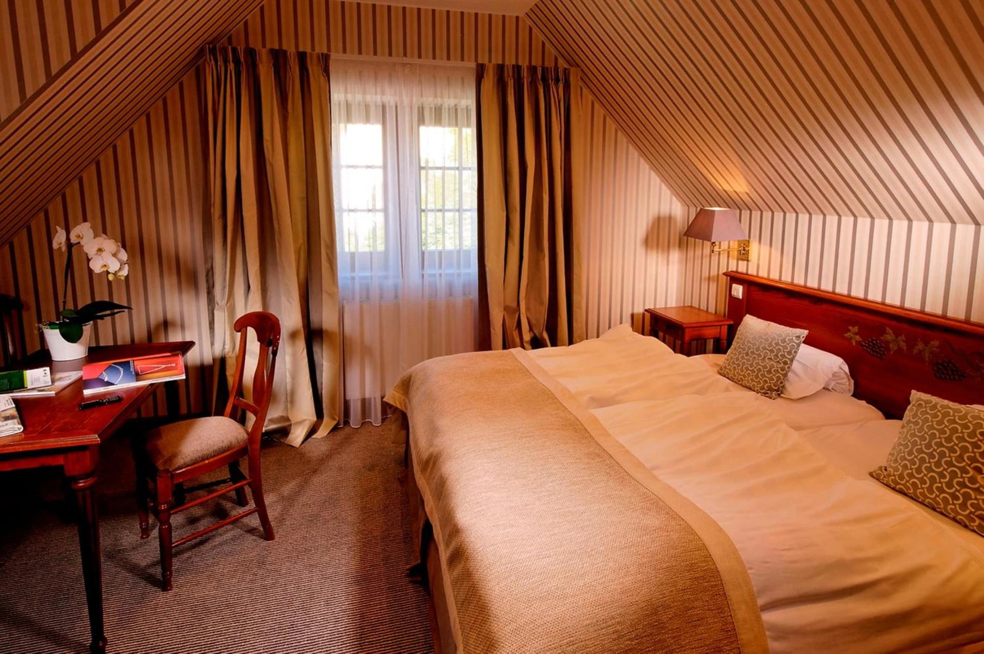 Magnifique chambre pour un séminaire d'entreprise à Hotel Restaurant L'Ami Fritz - Ottrott