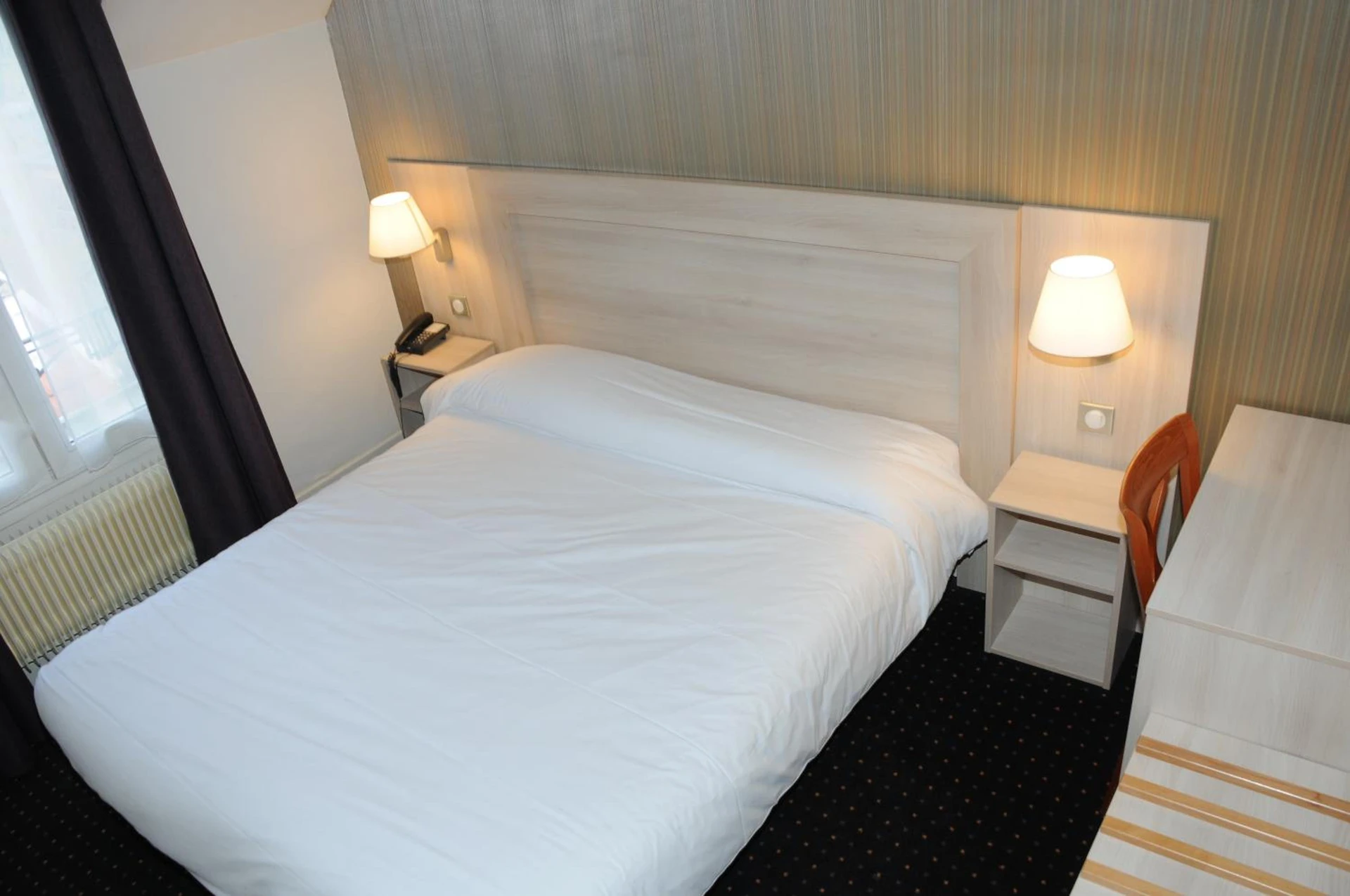 Chambre disponible pour un séminaire d'entreprise à Hôtel Patio Brancion - Malakoff