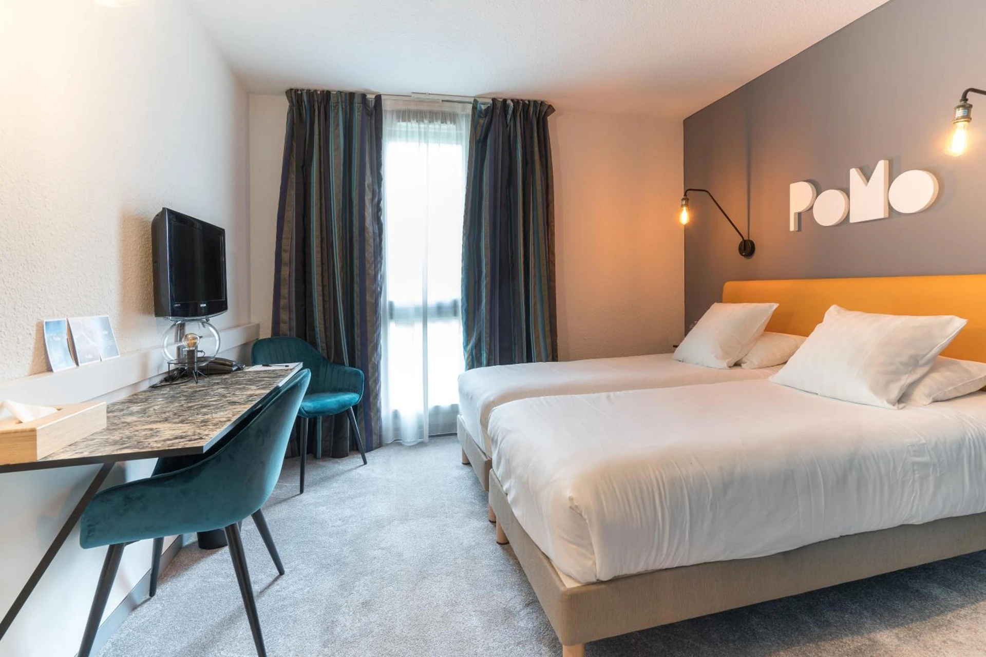 Chambre disponible pour un séminaire d'entreprise à PoMo Hôtel & Restaurant - Échirolles
