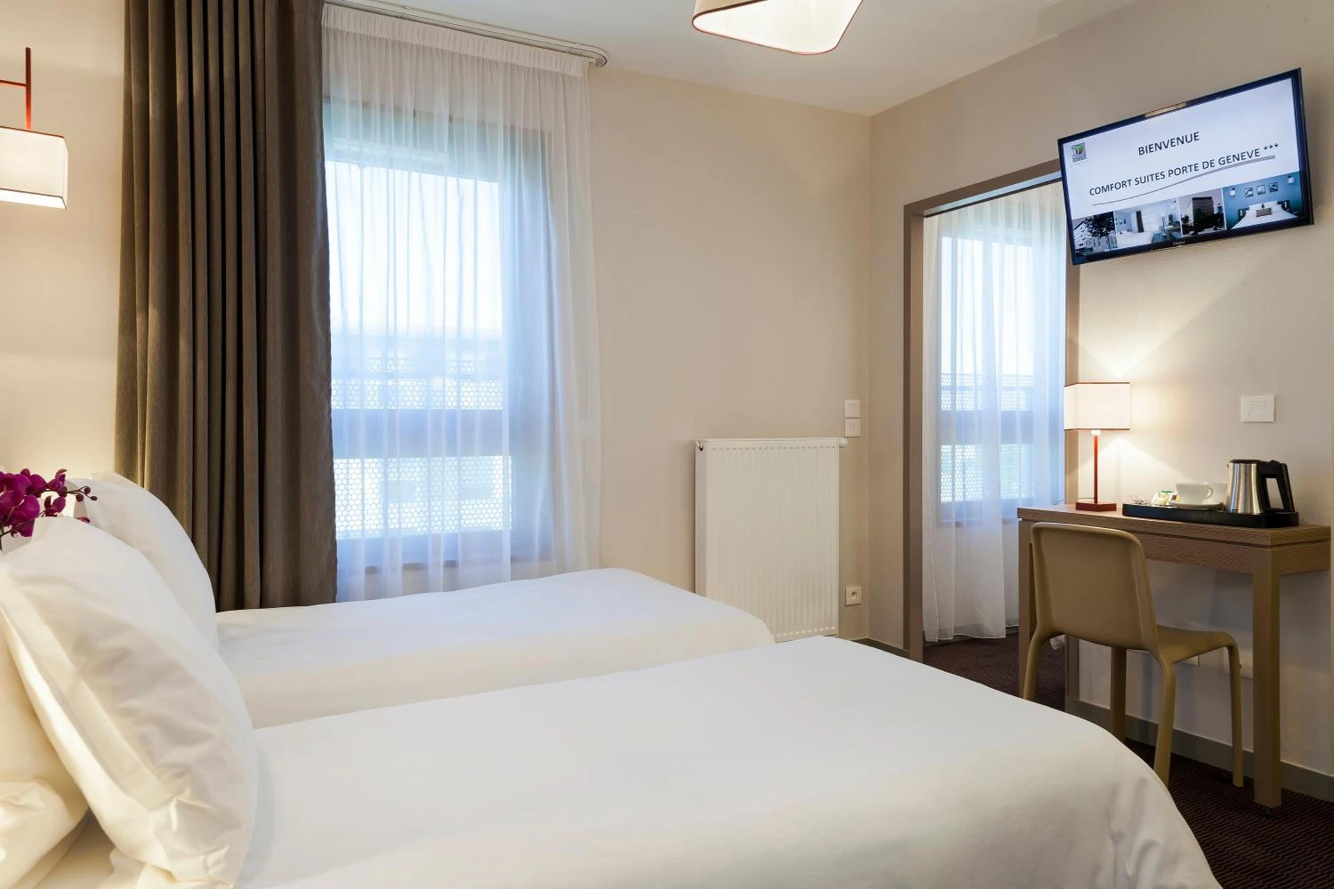 Chambre disponible pour un séminaire d'entreprise à Nehô Suites Porte de Genève - Gare Annemasse - Annemasse